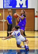 Danielle Coleman, #4, drives to the basket.