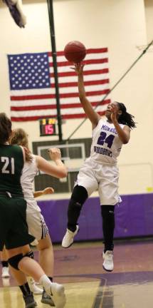 Taylor Neely (#24) drives to the basket.
