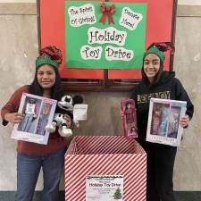 National Honor Society members help collect toys for the toy drive.