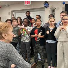 The students sang for the residents of the Promenade at Tuxedo Place.