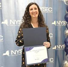 Liz Barbulean with her NYSEC award.