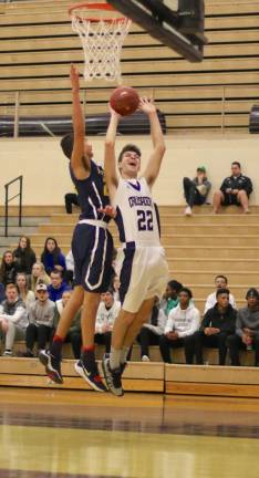 Jack Dembia (#22) drives to the basket in the first half.