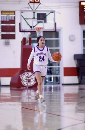 Brianna Taveras, #24, brings the ball up court.