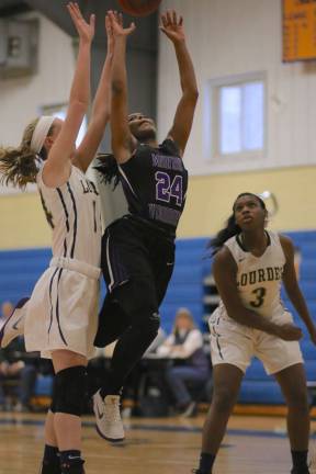 Taylor Neely (#24) drives to the basket in the second half.