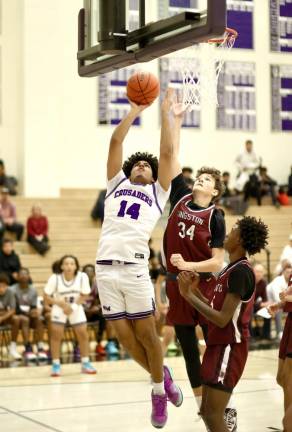 Alex Diaz, #14, drives to the basket.