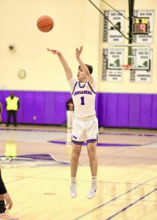 Jamie Reich, #1, hits a three-point shot.