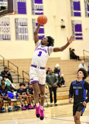 Fabrice Ndja, #3, explodes to the basket in the first half.