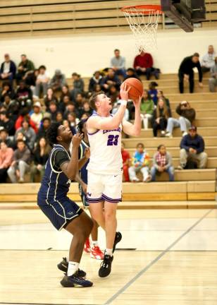 Senior Kyle McDermott, #23, comes down with another key rebound.