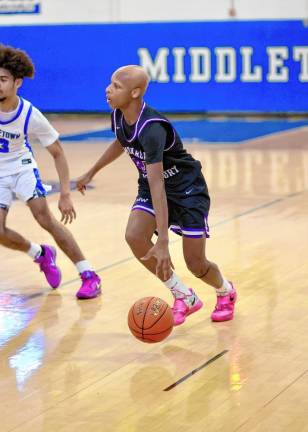 Kristopher Bjaelker, #20, hit two big threes in the fourth quarter.