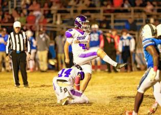 Crusader kicker Matvii Butiuhin, #40, kicks one of his six PATs in the game.