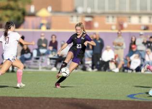 Kyra Gilligan, #23, takes a shot in the first half.