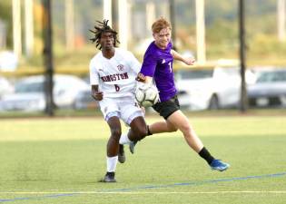 Sean Gilligan, #7, takes the ball away from a Tiger player.