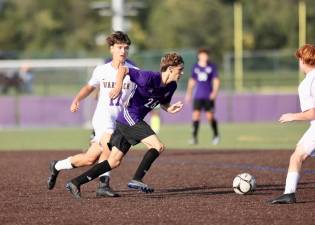 Klement Bujai, #26, weaves through the Wildcat defense.