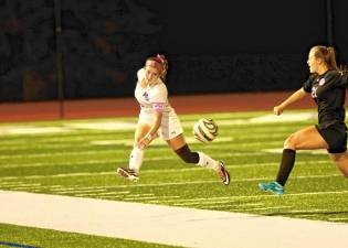 Crusader defender Lila King clears the ball out of the defensive end.