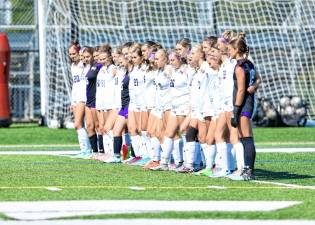 The girls’ varsity soccer team lines up before their scrimmage with DePaul Catholic on Monday.