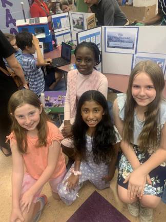 North Main fourth graders Reagan Fumagalli, Eden Ilori, Eva Francis, and Violet Korba present “The Extravagant Hotel.”