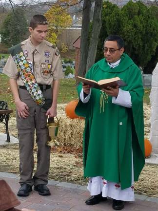 Photos provided Steven Chanat with the Rev. Bladi Socualaya-Miranda as he presides over the dedication ceremony of the memorial patio at St. Anastasia. Parishioners and the public purchased pavers to be engraved to honor loved ones.