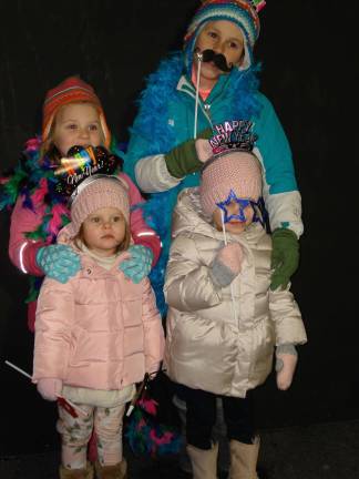 Goshen's ball drop party has an early party for kids along with the countdown at midnight for adults. Pictured at the party last year are sisters Anna and Lea DiGiovanni (in the rear) with their cousins, Emma and Adeline DiGiovanni, who are also sisters. All the children live in Goshen. (Photo by Geri Corey)