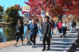 CROP Hunger Walk participants walk the Millponds in Monroe on Oct. 27.