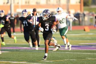 Louis Meade, #3, races 61 yards to put the Crusaders up 6-0 in the first quarter.