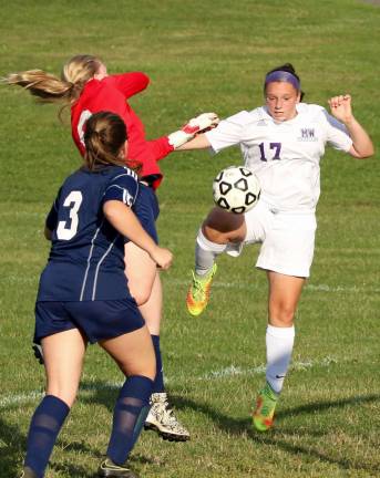 Amara Hatzis (#17) scores her second goal of the game as the Pine Bush goalie fails to control the ball.