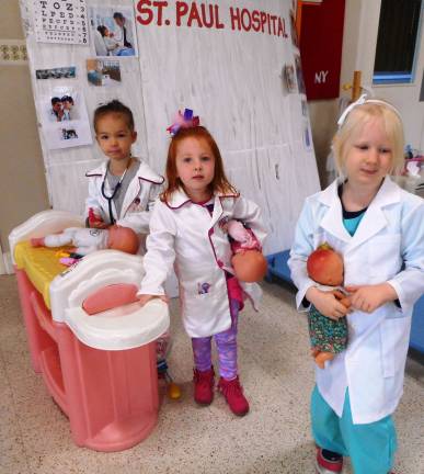 Photos by Ramona Adams Drs. Abigail Ritchie, Harper Kennis and Claire Hernon take care of the babies.
