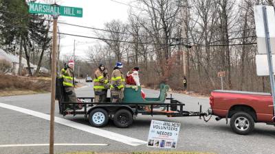 <b>Firefighters with Greenwood Forest Volunteer Fire Company #3 escort Santa through West Milford neighborhoods Sunday, Dec. 15. (Photo by Kathy Shwiff)</b>