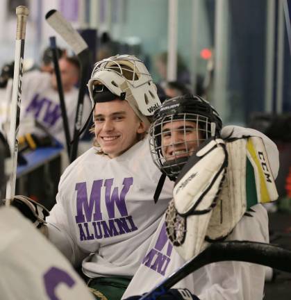 Photos by Bill CareyDaniel Dorney (&#x2019;17) and Anthony Proietto (&#x2019;16) share a moment during the Monroe-Woodbury Hockey Alumni game on Nov. 25. Dorney is playing hockey on the SUNY Oswego ACHA D1 Club team and Proietto is in the U.S. Marine Corps.