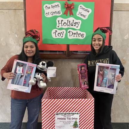 National Honor Society members help collect toys for the toy drive.