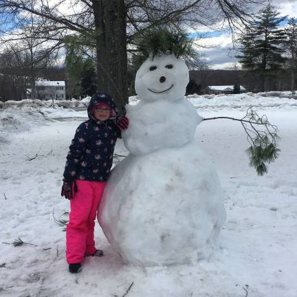 Photo providedPine Tree Elementary School third-grader Lexie Hawkes and her father Fred Hawkes built this snowman at the school this past Sunday following the March 2 Nor&#x2019;Easter named Riley. The duo named him Piney. The Photo News was told Piney was quite &#x201c;the snow celebrity&#x201d; when the students and staff arrived to school on Monday morning.