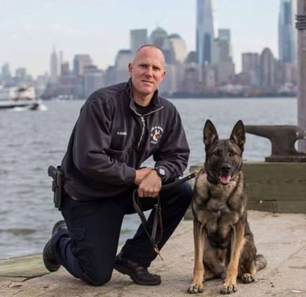 The Town of Woodbury Police Officer Jahn Farrell with K9 Zeke. Zeke will receive a bullet and stab protective vest thanks to a charitable donation from the non-profit organization, Vested Interest in K9s, Inc.