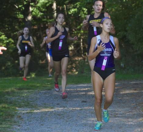 Julia Hoyt came out of the woods and fought her way to a tough fourth-place finish in the varsity race.