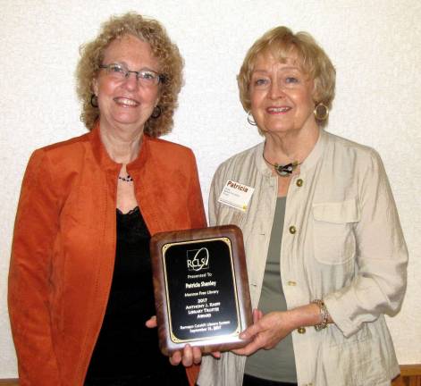 Provided photo Pictured from left to right are: Marilyn McIntosh, the eExecutive director of the Monroe Free Library, and Patricia Shanley, president of the Board of Trustees.