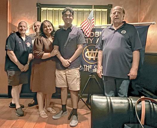 Jonathan Varghese with his parents, scholarship Chairman Dan Lux and Community Association President John Kelemen.