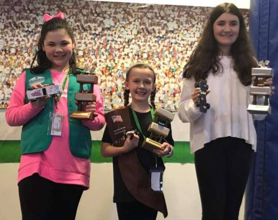 Photo provided Overall winners of the sixth annual Monroe Girl Scout Community's Powder Puff Derby, held at the South Orange Family YMCA are, from the left: Junior Girl Scout Alexandra Sagaria, third place; Brownie Girl Scout Amanda Sikorsky, first place; and Cadette Girl Scout Aryana Brunning, second place.