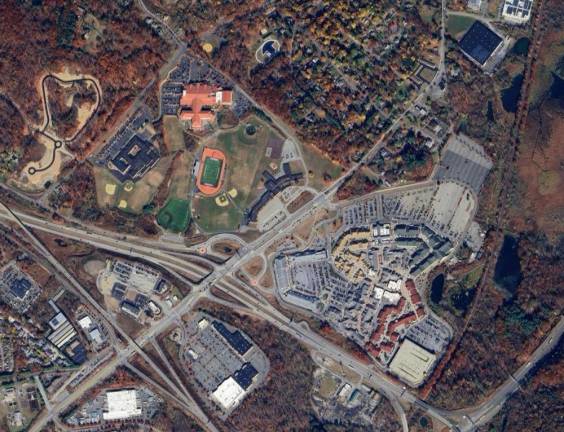 The Monroe-Woodbury school district (left) is directly across from Woodbury Common (right), separated by Route 32.