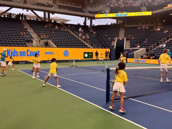 Twenty-four young players from Matchpoint Tennis in Goshen rallied on Louis Armstrong Stadium as part of the US Open Net Generation Experience.