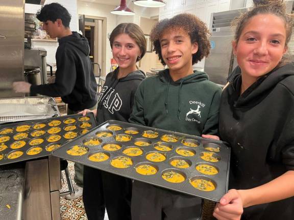 Gabi Patsiner, Jaden Shaw and Lizzie Deskin, sophomores at Monroe-Woodbury, baked pumpkin muffins from scratch at Chabad’s CTeen program to be delivered to the first responders of the Jennings Creek Wildfire.