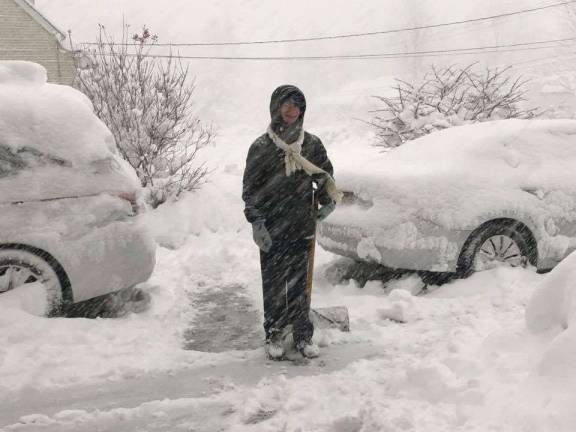 Dominic Wasto of Monroe begins shoveling snow away from his family&#x2019;s cars and clearing the driveway during the March 7 storm known as Quinn.