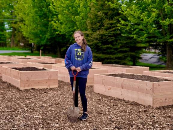 To earn her Girl Scout Gold Award, Kelly Imhof built the Monroe Community Garden outside Town Hall.