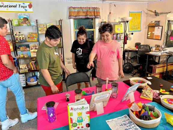 Kids check out some of the offerings during the store’s grand opening weekend.