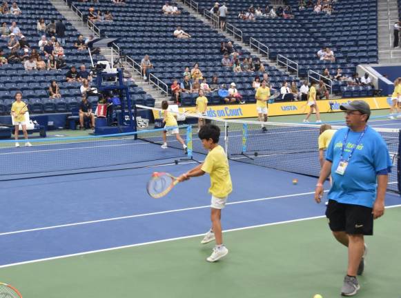 Matchpoint Tennis president Ari Roberts oversees the on-court demo on Aug. 29.