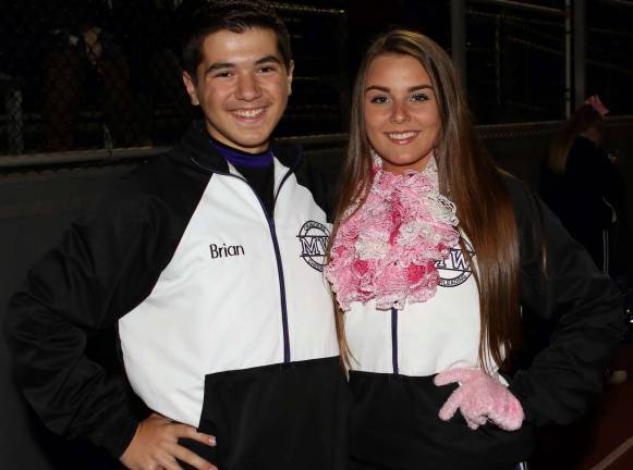 Cheerleaders Brian Hawkenberry and Stephanie Sullivan are ready for the game to begin.