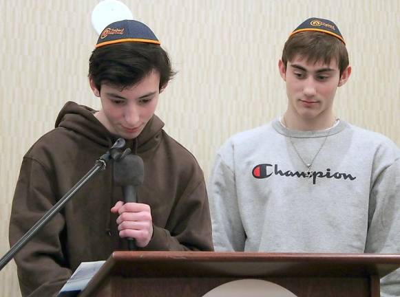 Evan Leeds of Chester leads a community prayer at the ribbon cutting of the new CTeen Lounge At Chabad of Orange County.