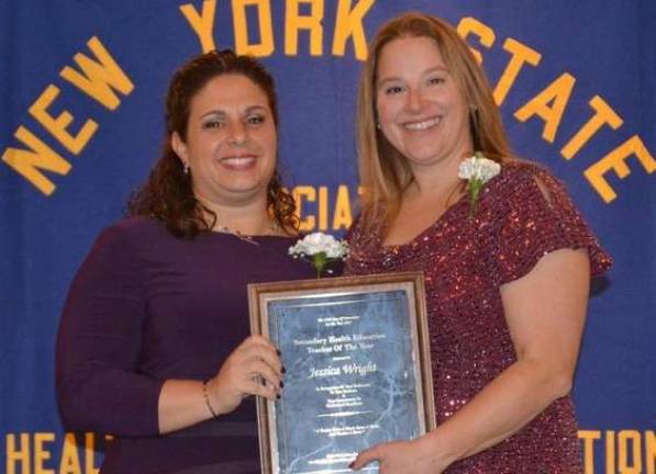 Provided photo Monroe-Woodbury's Health Education Coordinator Jessica Wright, left, accepts her award as New York Teacher of the Year for the Secondary Level. The award was presented at the annual conference of the New York State Association for Health, Physical Education, Recreation and Dance.