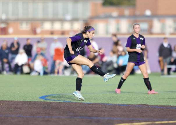 Kate Allen, #13, drills her second goal of the game from outside the box.