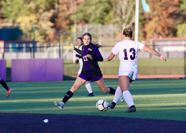 Kate Allen’s, #13, strong play has helped the Crusaders go undefeated.