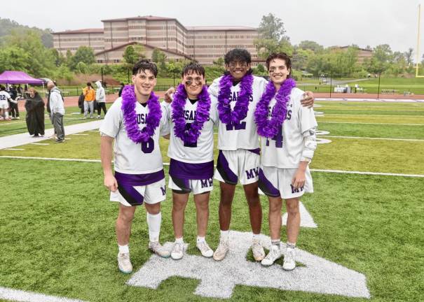 Crusader seniors were honored after the game. L-R: Dominick Cosenza, Brian Sullivan, David Persaud, and Carson Pesce.