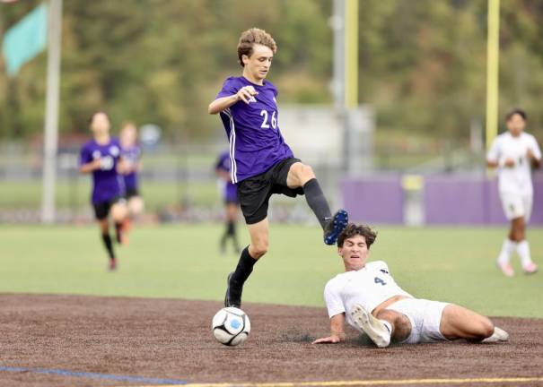 Klement Bujaj, #26, and a Goldback defender battle for the ball.