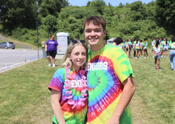 Seniors Gianna Miale and Robert Scheck with their tie-dyed shirts.